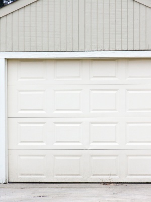 Fixing common garage door issues to ensure proper functionality at a residential location during daylight hours Fixing common garage door issues