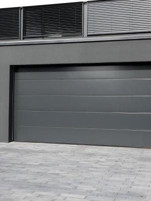 Garage door repair and maintenance at a modern residential property located in an urban environment Garage door repair and maintenance