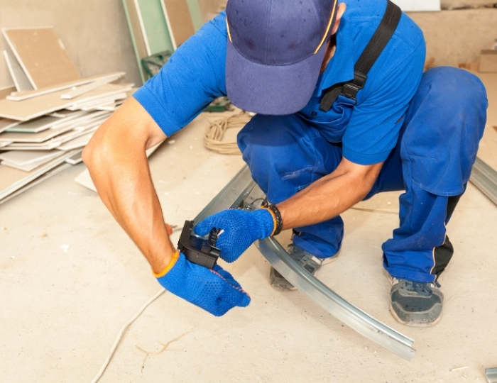 Garage door technician performs repair work in St Albert on a residential property