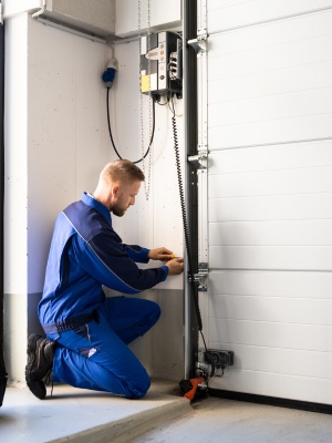 Expert lift master opener installation in Edmonton with a technician working diligently Expert lift master opener installation in Edmonton with a technician working diligently