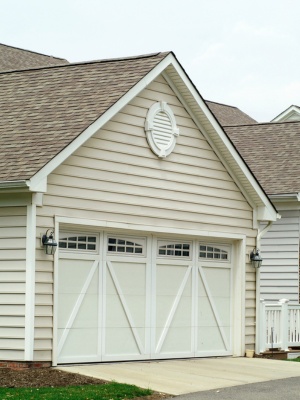 Garage door repair service enhancing residential property in Edmonton during daylight hours Garage door repair service enhancing residential property in Edmonton during daylight hours