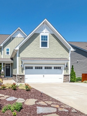 Professional garage door service for residential properties in Edmonton on a sunny day Professional garage door service for residential properties in Edmonton on a sunny day