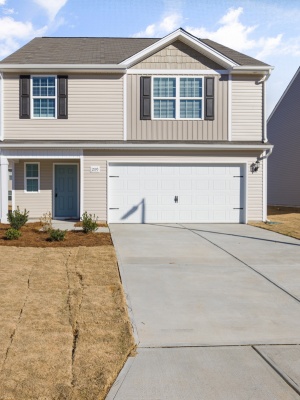 Stylish steel garage doors enhance a home in Edmonton, offering durability and modern appeal in residential architecture Stylish steel garage doors enhance a home in Edmonton, offering durability and modern appeal in residential architecture